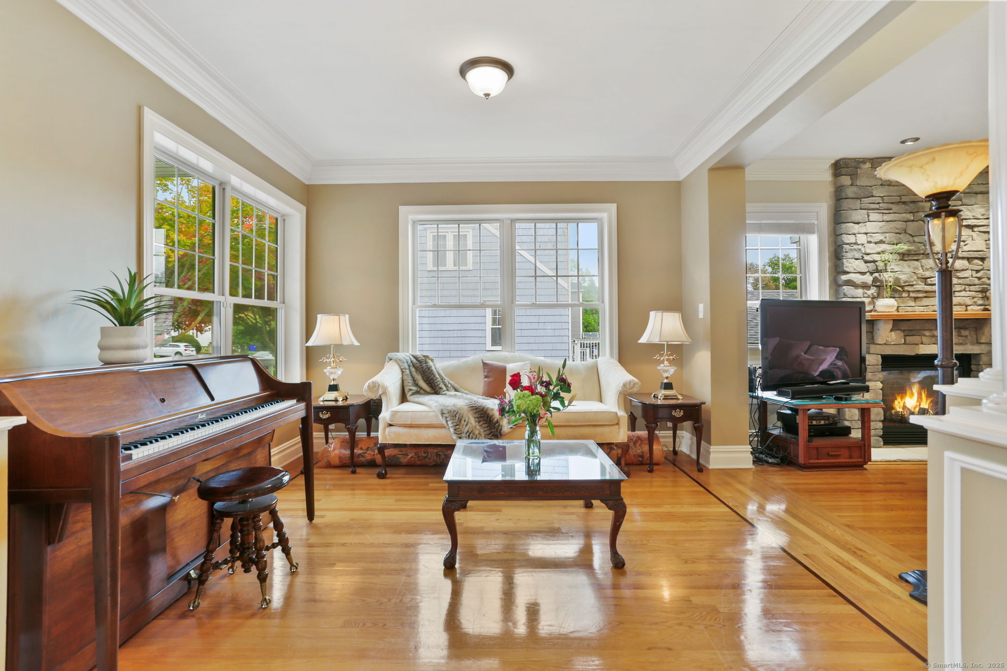 25 Country Road, Unit 25 Fairfield, CT 06824 - Photo 15 of 40 a living room with fireplace furniture and a flat screen tv