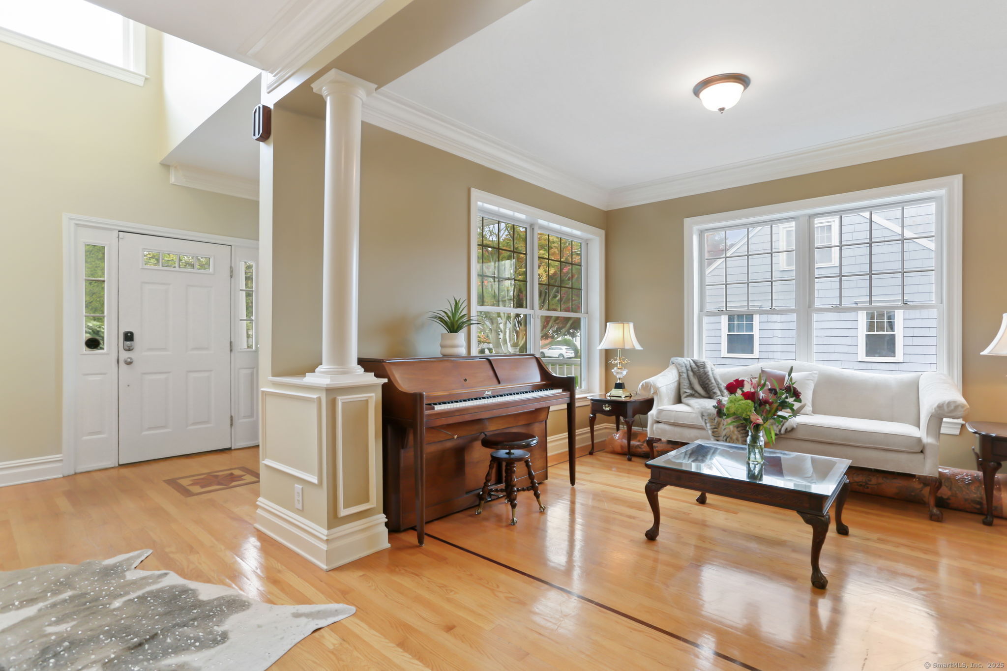25 Country Road, Unit 25 Fairfield, CT 06824 - Photo 16 of 40 a living room with furniture and windows