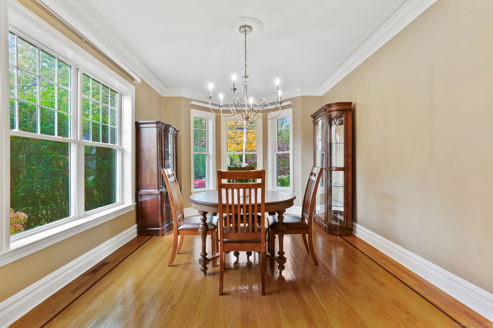 25 Country Road, Unit 25 Fairfield, CT 06824 - Photo 24 of 40 a view of a dining room with furniture window and wooden floor
