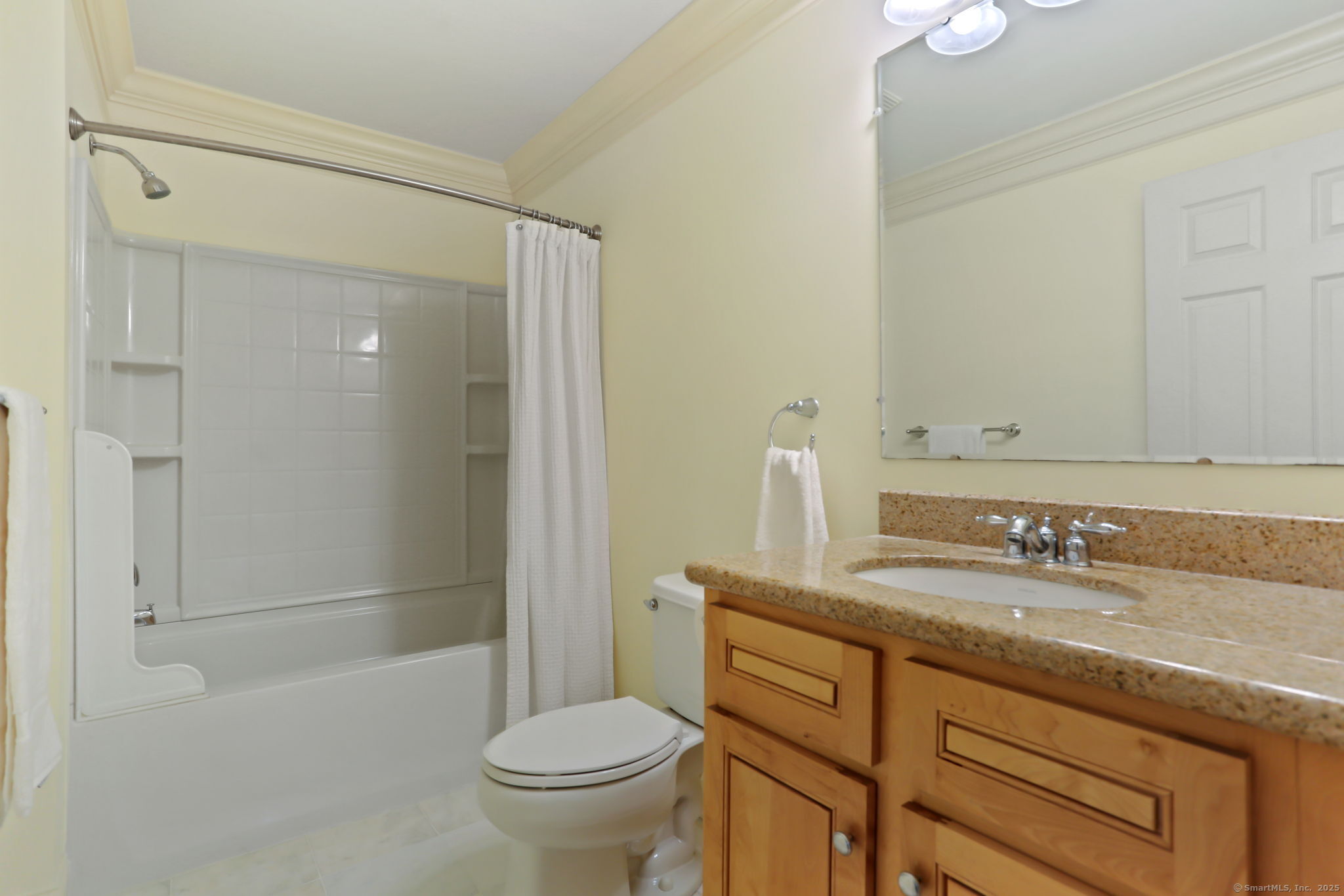 25 Country Road, Unit 25 Fairfield, CT 06824 - Photo 29 of 40 a bathroom with a granite countertop sink toilet and shower