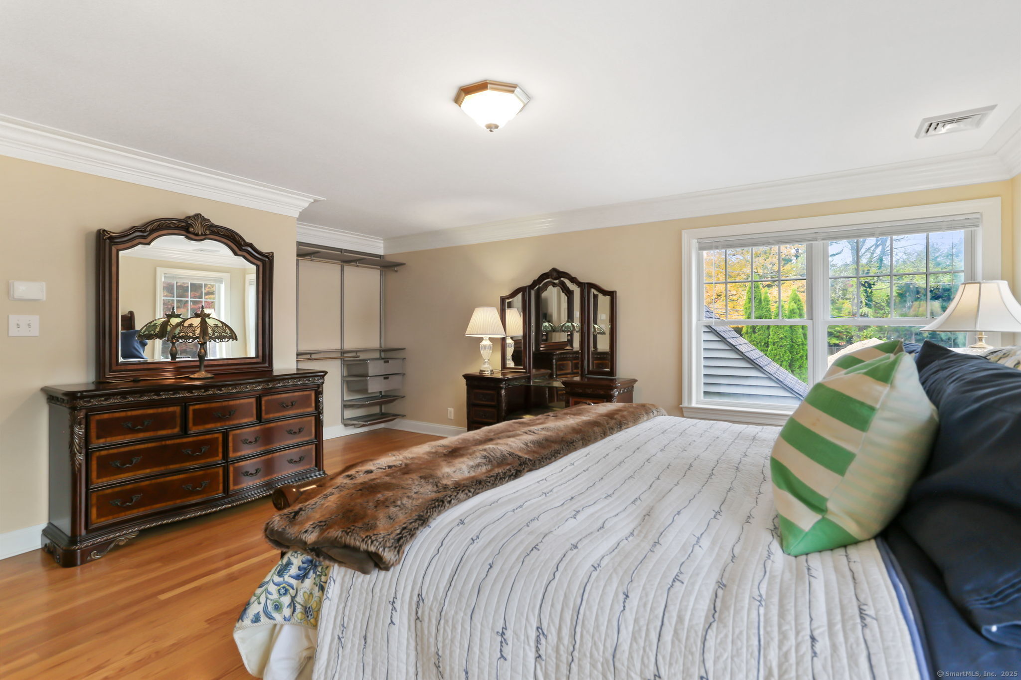 25 Country Road, Unit 25 Fairfield, CT 06824 - Photo 31 of 40 a bed room with a bed and a dresser