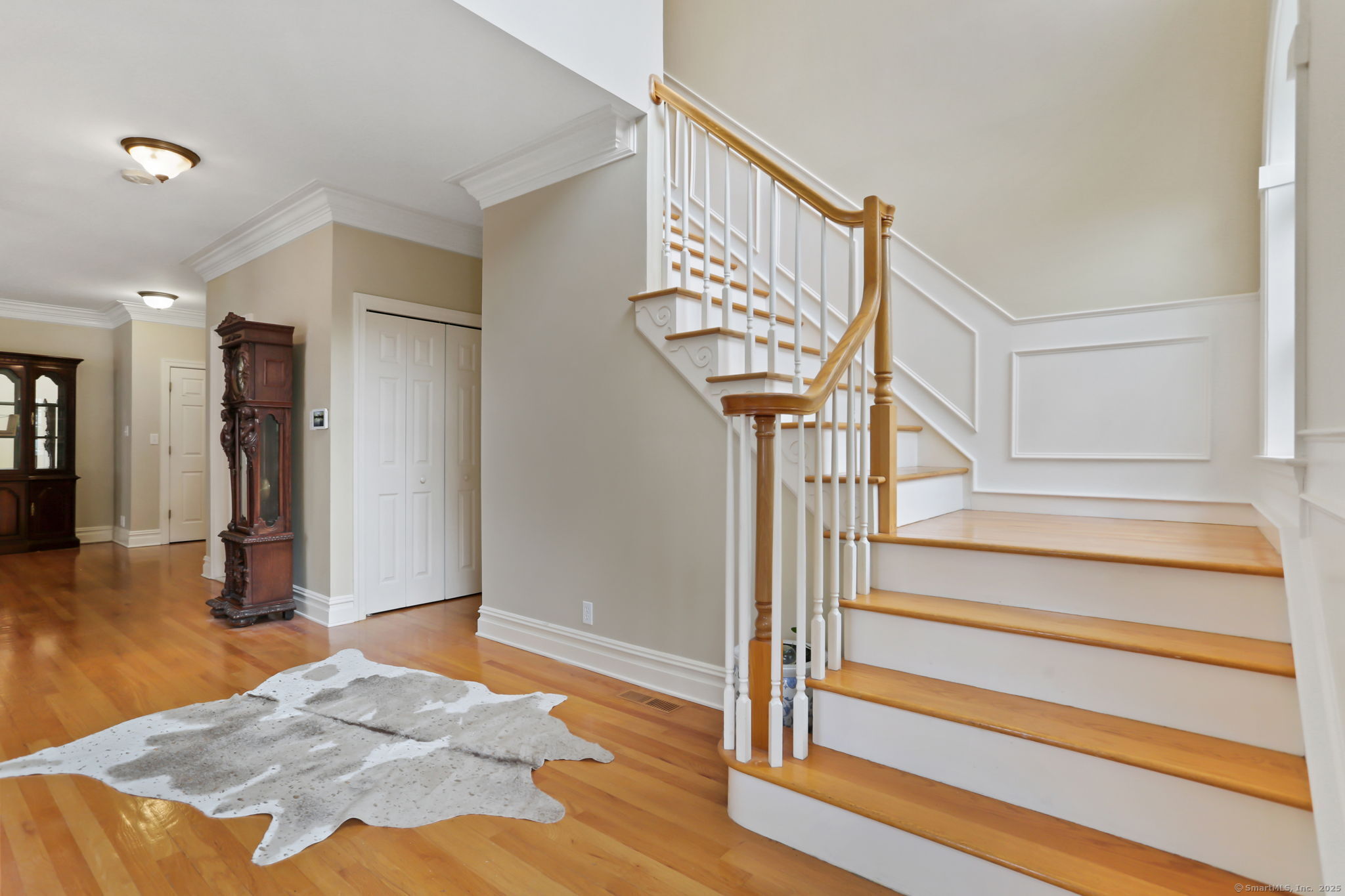25 Country Road, Unit 25 Fairfield, CT 06824 - Photo 9 of 40 a view of entryway and hall with wooden floor