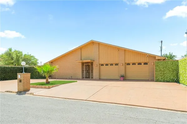 a backyard of a house with garage