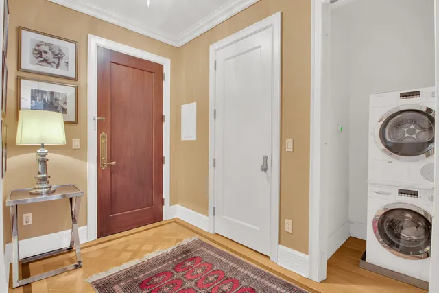 a view of a bedroom with washer and dryer