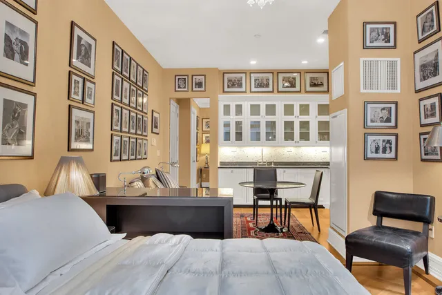 a bedroom with furniture and a chair