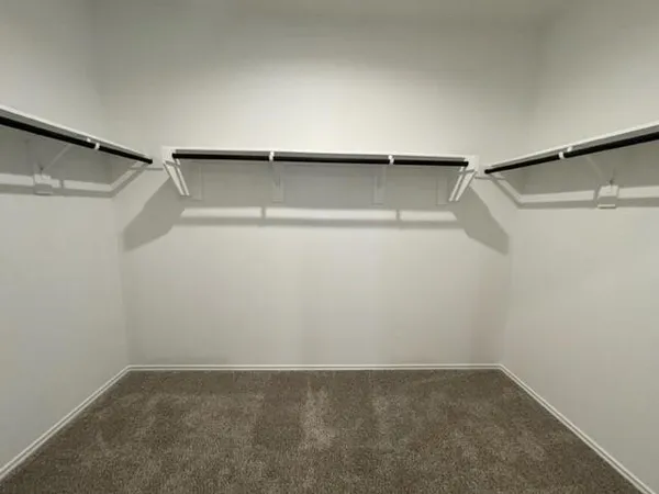 a view of an empty walk in closet