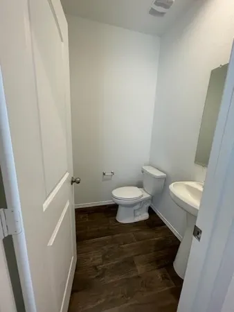 a bathroom with a toilet and a sink
