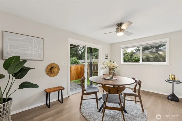 a view of a dining room with furniture window and wooden floor