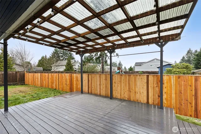 a view of patio with wooden floor