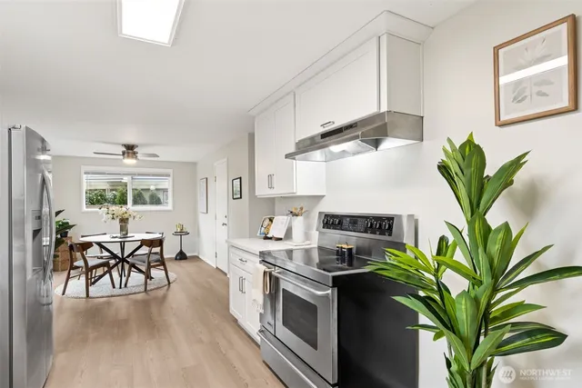 a kitchen with appliances and cabinets