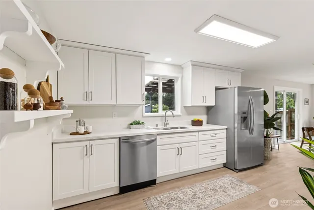 a kitchen with a sink and cabinets