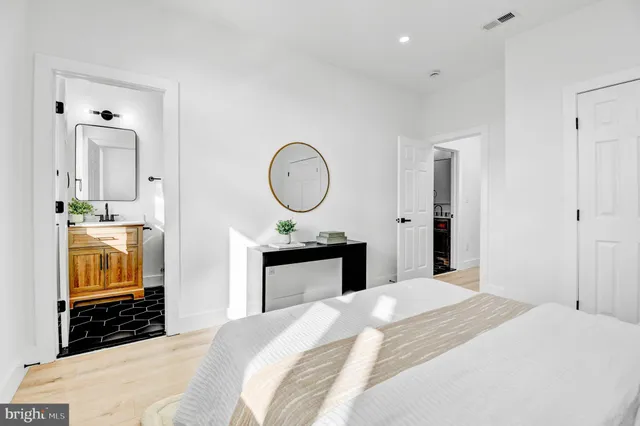 a bedroom with bed and a closet