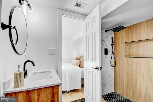 a bathroom with a tub and a shower