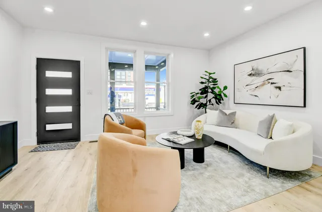 a living room with furniture and window