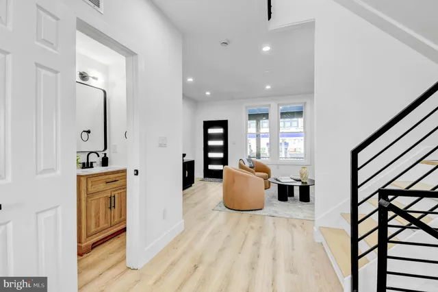 a view of kitchen with furniture and wooden floor