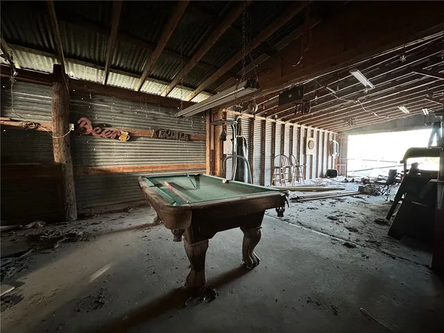a view of a chairs and table in the patio