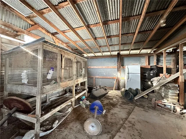 an aerial view of a house with a yard and lake view