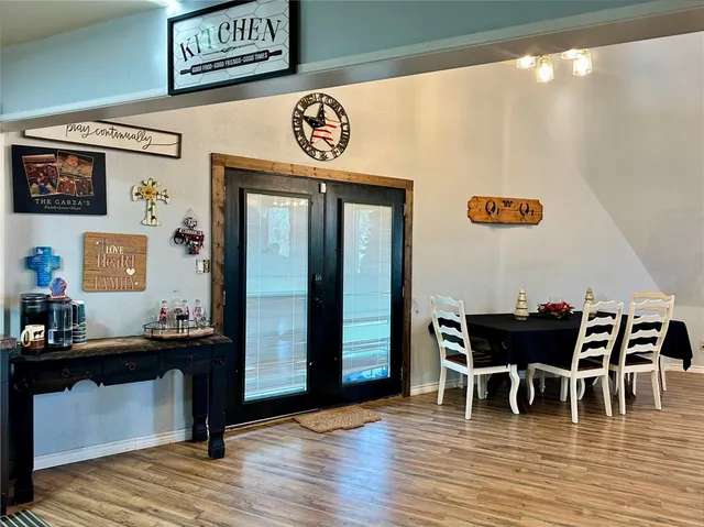 a view of a dining room with furniture and wooden floor