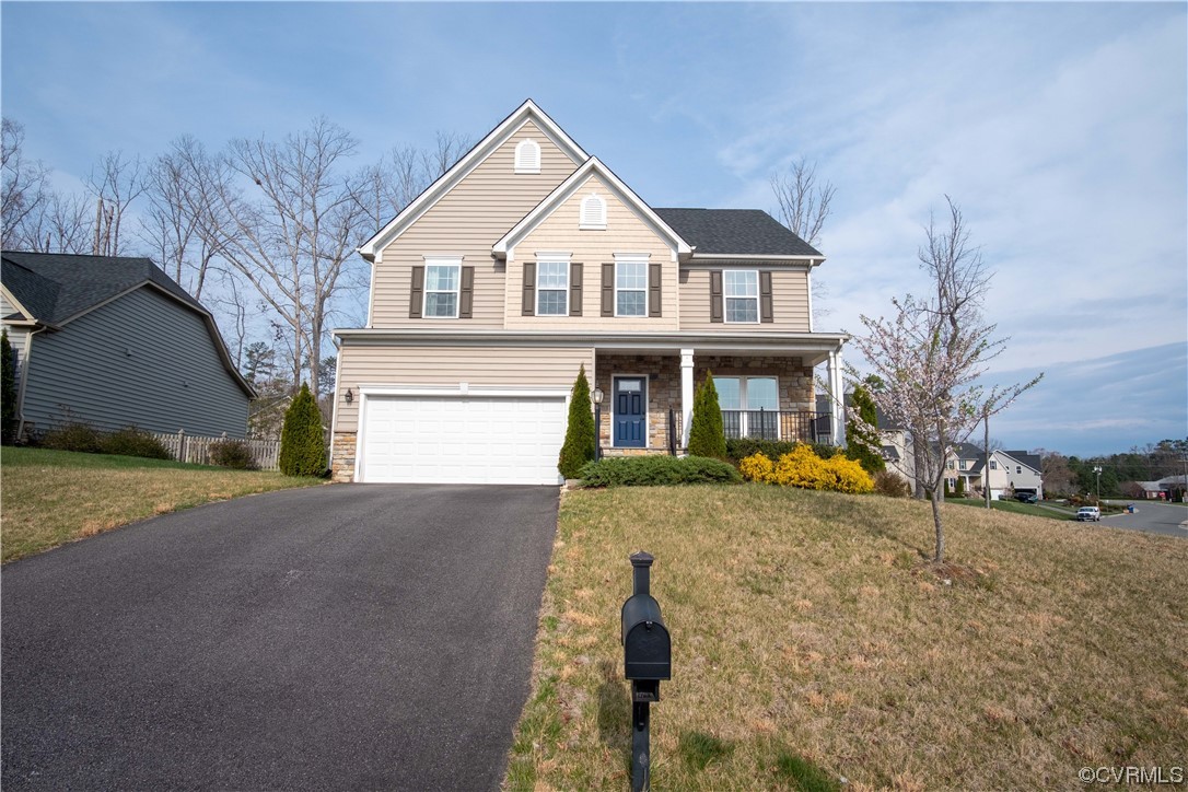 12800 Bailey Valley Drive Midlothian, VA 23112 - Photo 1 of 31 a front view of a house with a yard and garage