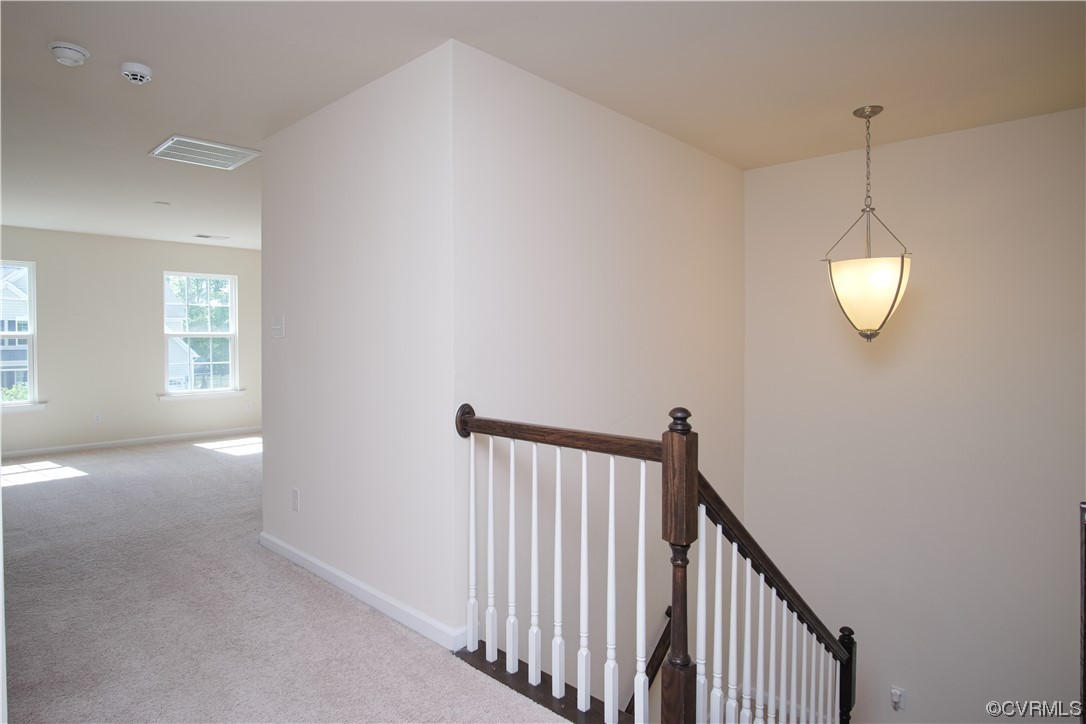 12800 Bailey Valley Drive Midlothian, VA 23112 - Photo 16 of 31 a view of a hallway with windows and chandelier fan