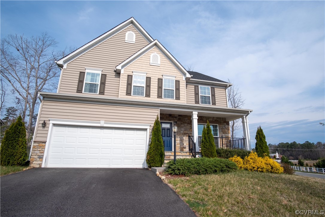 12800 Bailey Valley Drive Midlothian, VA 23112 - Photo 2 of 31 a front view of a house with a yard and garage