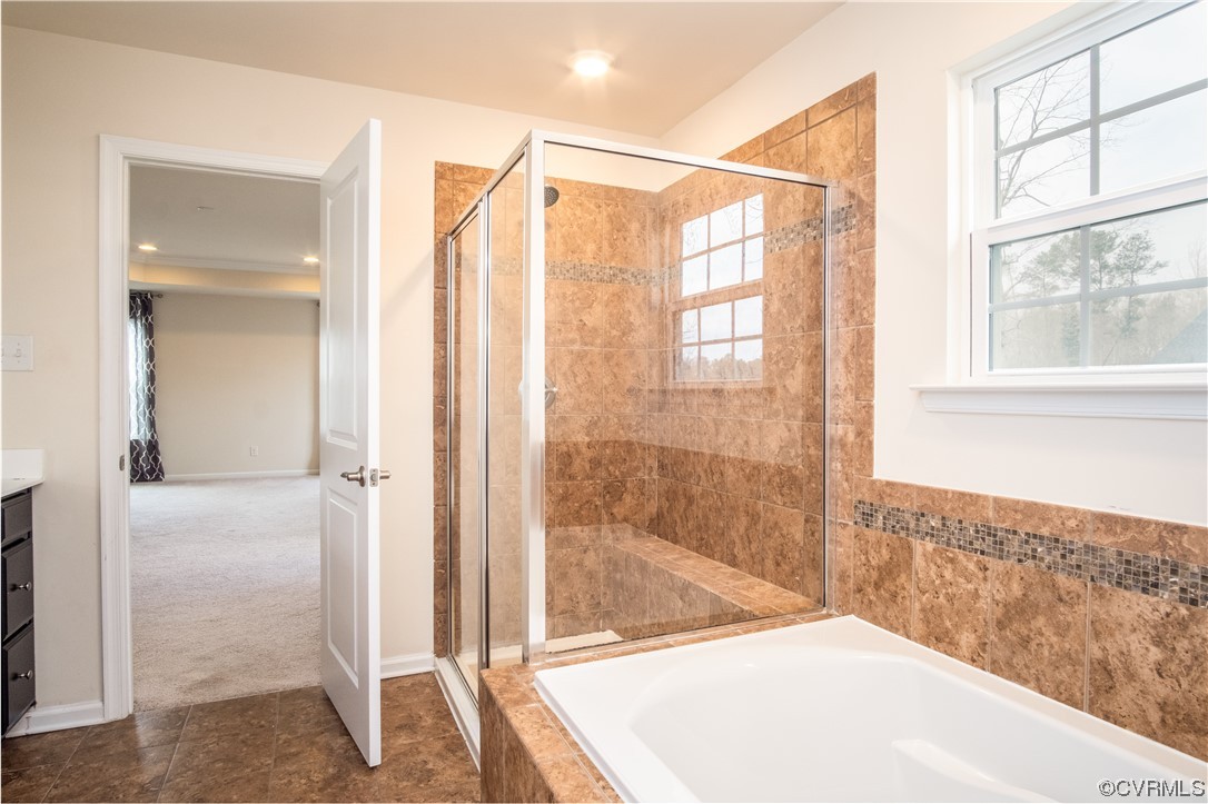 12800 Bailey Valley Drive Midlothian, VA 23112 - Photo 23 of 31 a bathroom with a bathtub and a shower
