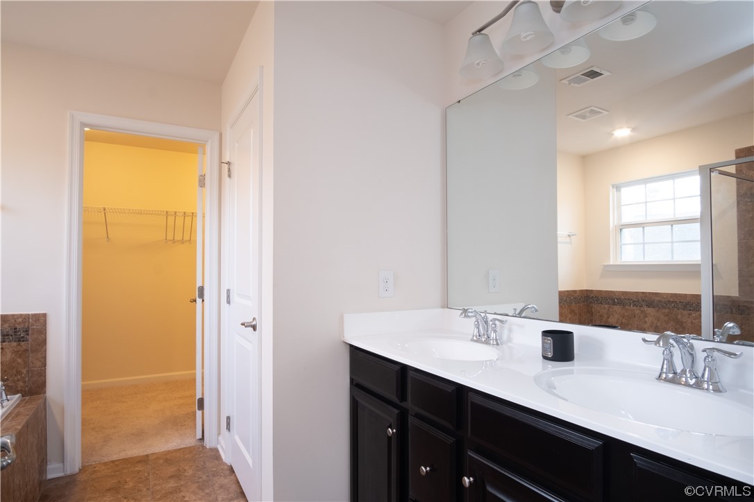 12800 Bailey Valley Drive Midlothian, VA 23112 - Photo 24 of 31 a bathroom with a double vanity sink a mirror and a bathtub