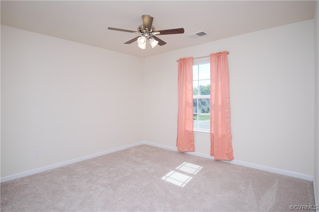 12800 Bailey Valley Drive Midlothian, VA 23112 - Photo 27 of 31 an empty room with a window and a fan