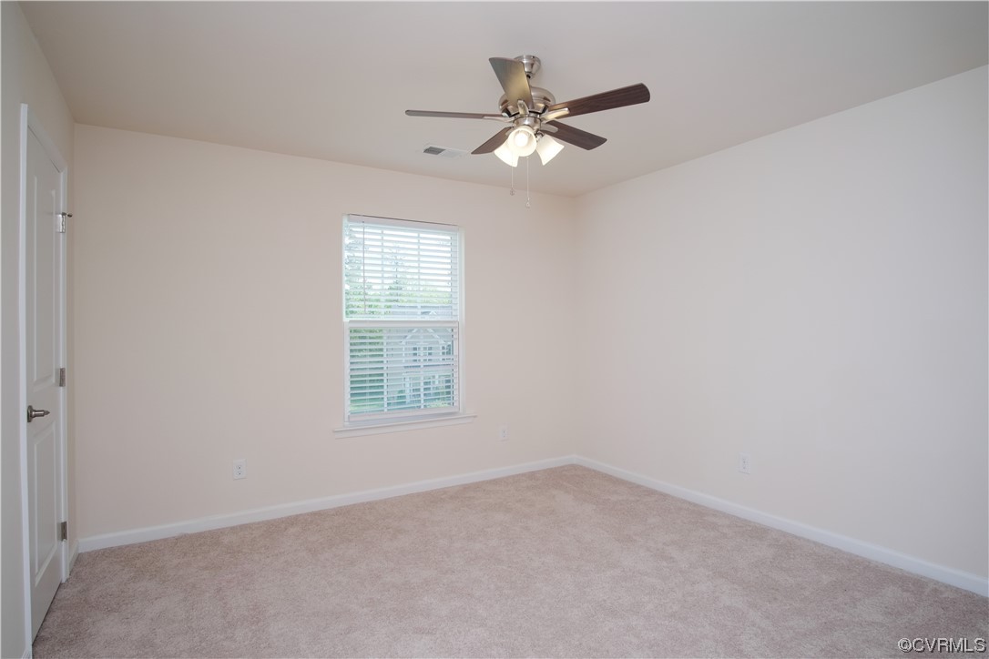 12800 Bailey Valley Drive Midlothian, VA 23112 - Photo 28 of 31 an empty room with a window and a fan