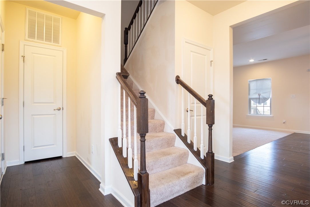 12800 Bailey Valley Drive Midlothian, VA 23112 - Photo 9 of 31 a view of an entryway with wooden floor and stairs
