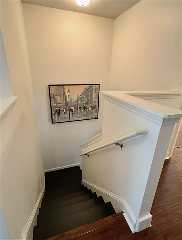 4832 Batiste Lane Acworth, GA 30101 - Photo 13 of 27 a view of a hallway with wooden floor