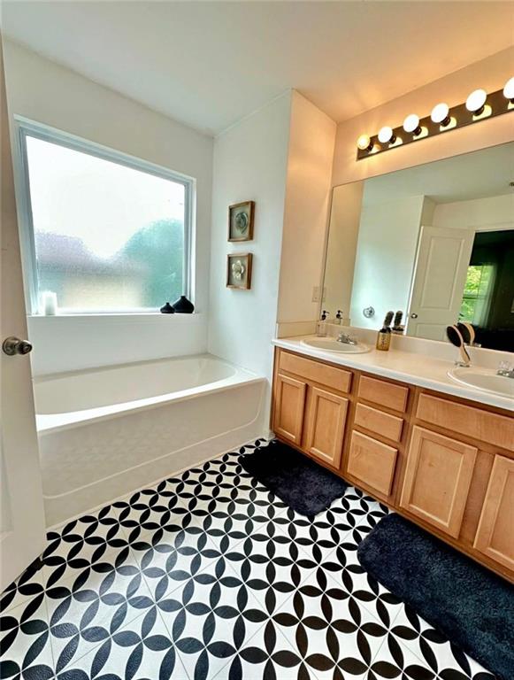 4832 Batiste Lane Acworth, GA 30101 - Photo 19 of 27 a bathroom with a sink a vanity and a mirror