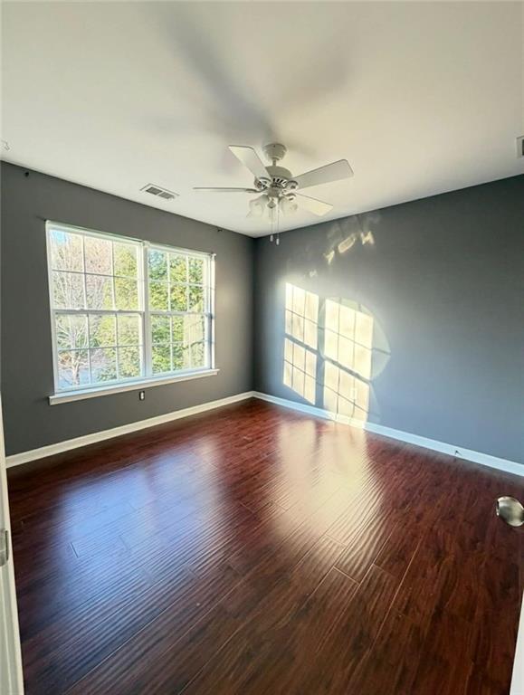 4832 Batiste Lane Acworth, GA 30101 - Photo 23 of 27 a view of an empty room with wooden floor and a window
