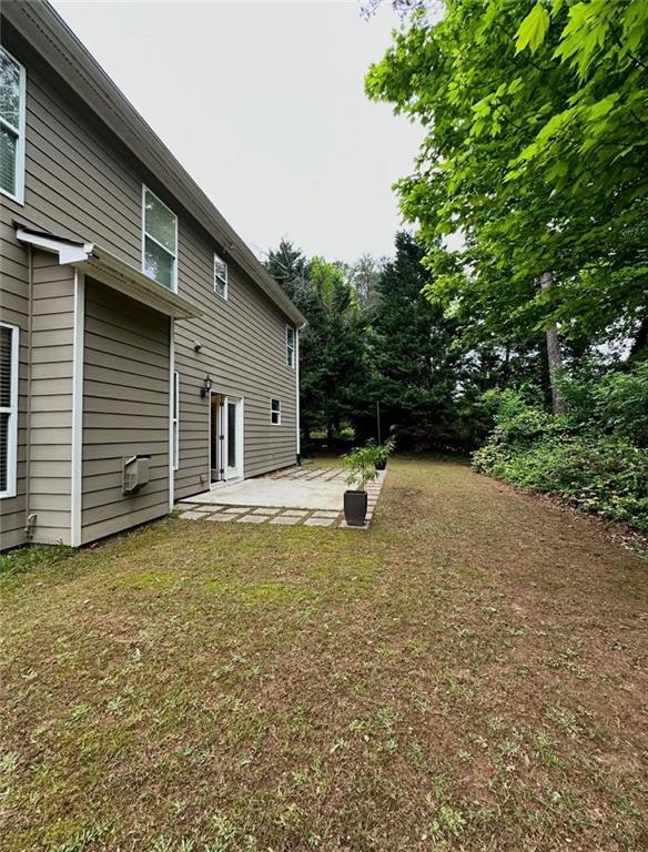 4832 Batiste Lane Acworth, GA 30101 - Photo 27 of 27 a view of a house with backyard and trees