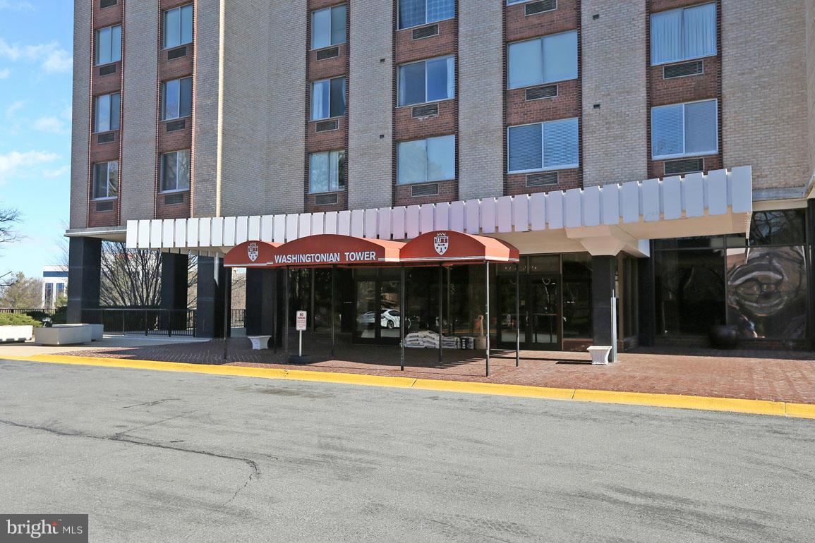 9701 Fields Road, Unit 603 Gaithersburg, MD 20878 - Photo 3 of 29 a view of a building with a swimming pool