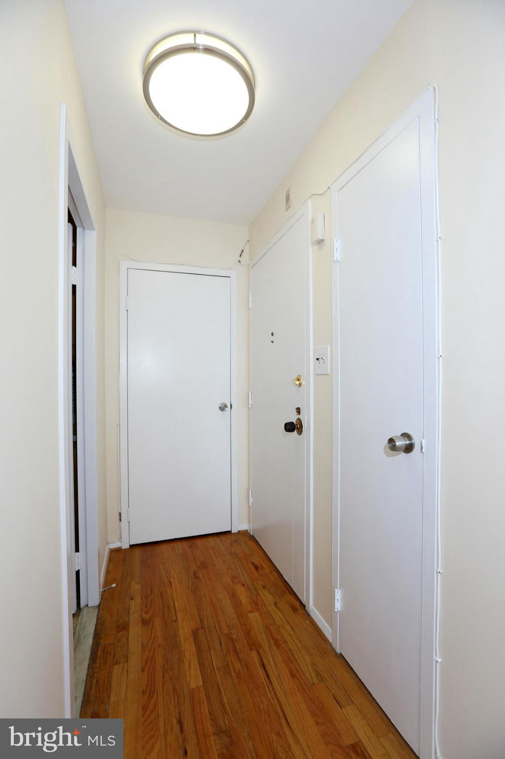 9701 Fields Road, Unit 603 Gaithersburg, MD 20878 - Photo 4 of 29 a view of a room with wooden floor and a carpet