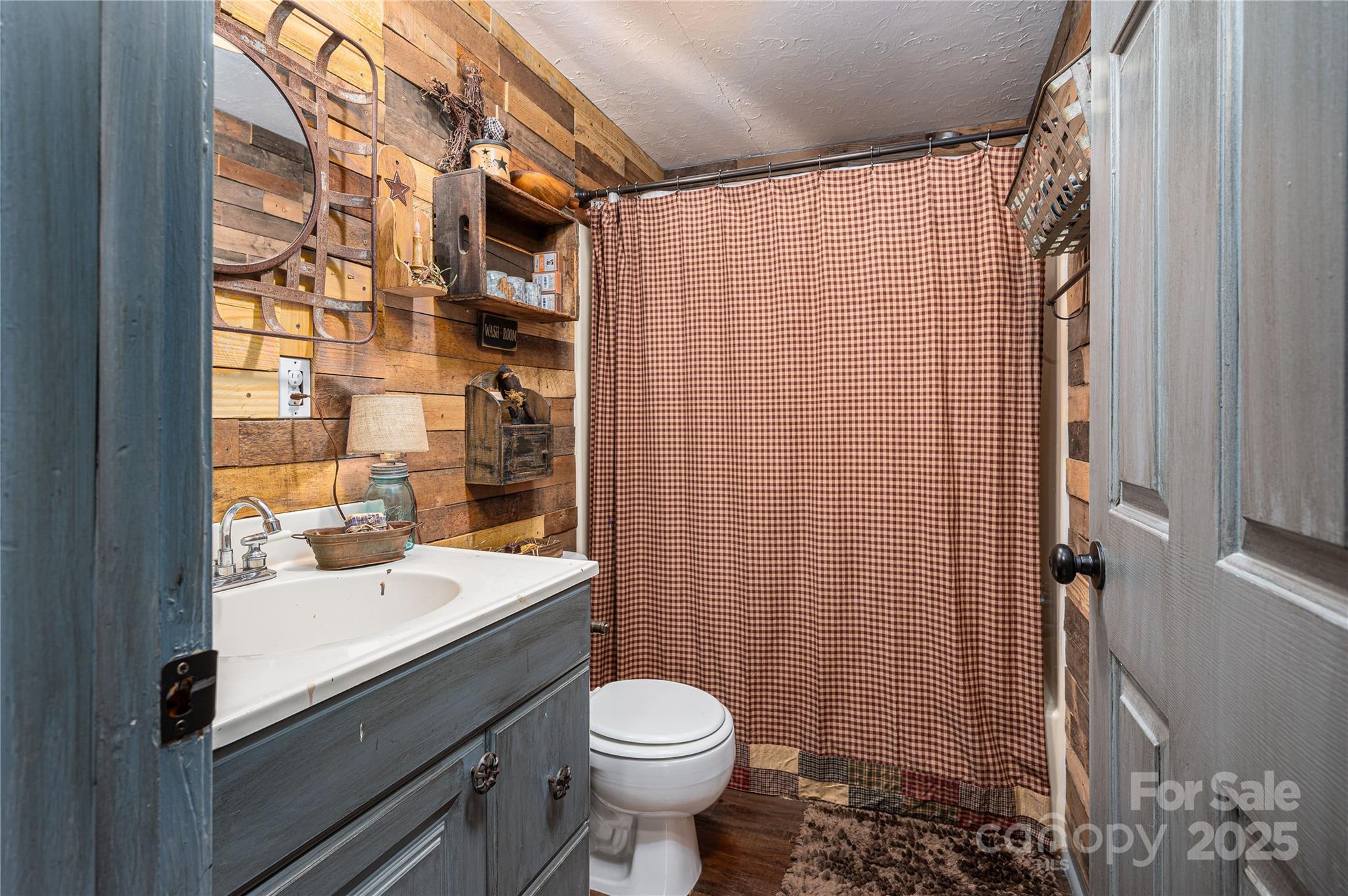 6312 Bill Ledford Road Vale, NC 28168 - Photo 18 of 42 a bathroom with a sink toilet and shower
