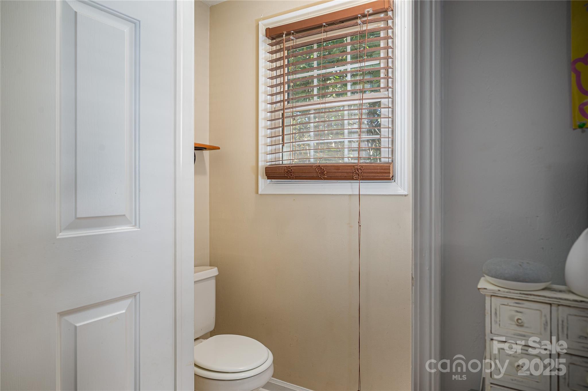 6312 Bill Ledford Road Vale, NC 28168 - Photo 22 of 42 a bathroom with a toilet a sink and a shower