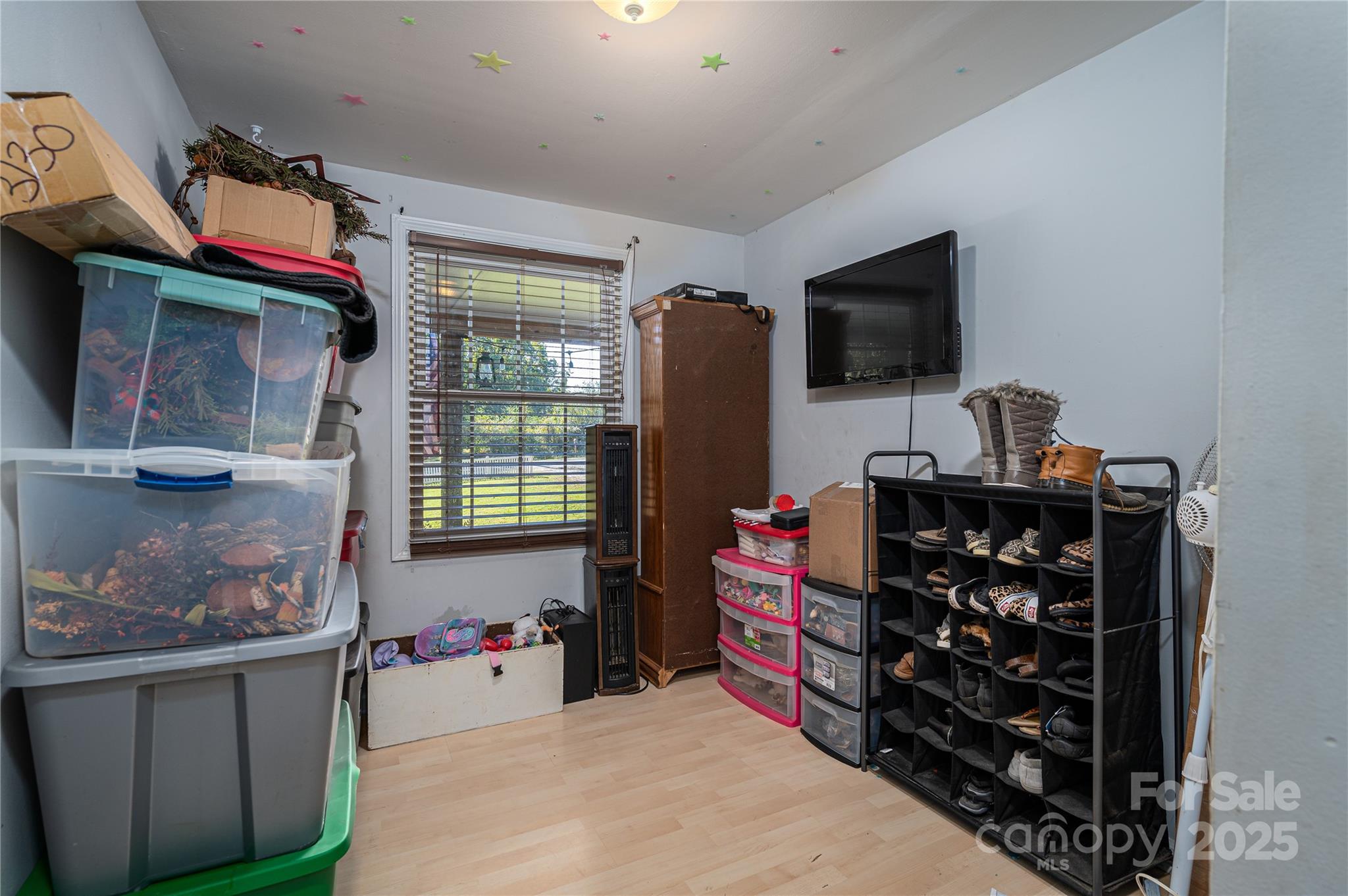 6312 Bill Ledford Road Vale, NC 28168 - Photo 23 of 42 a room with furniture a flat screen tv and a window