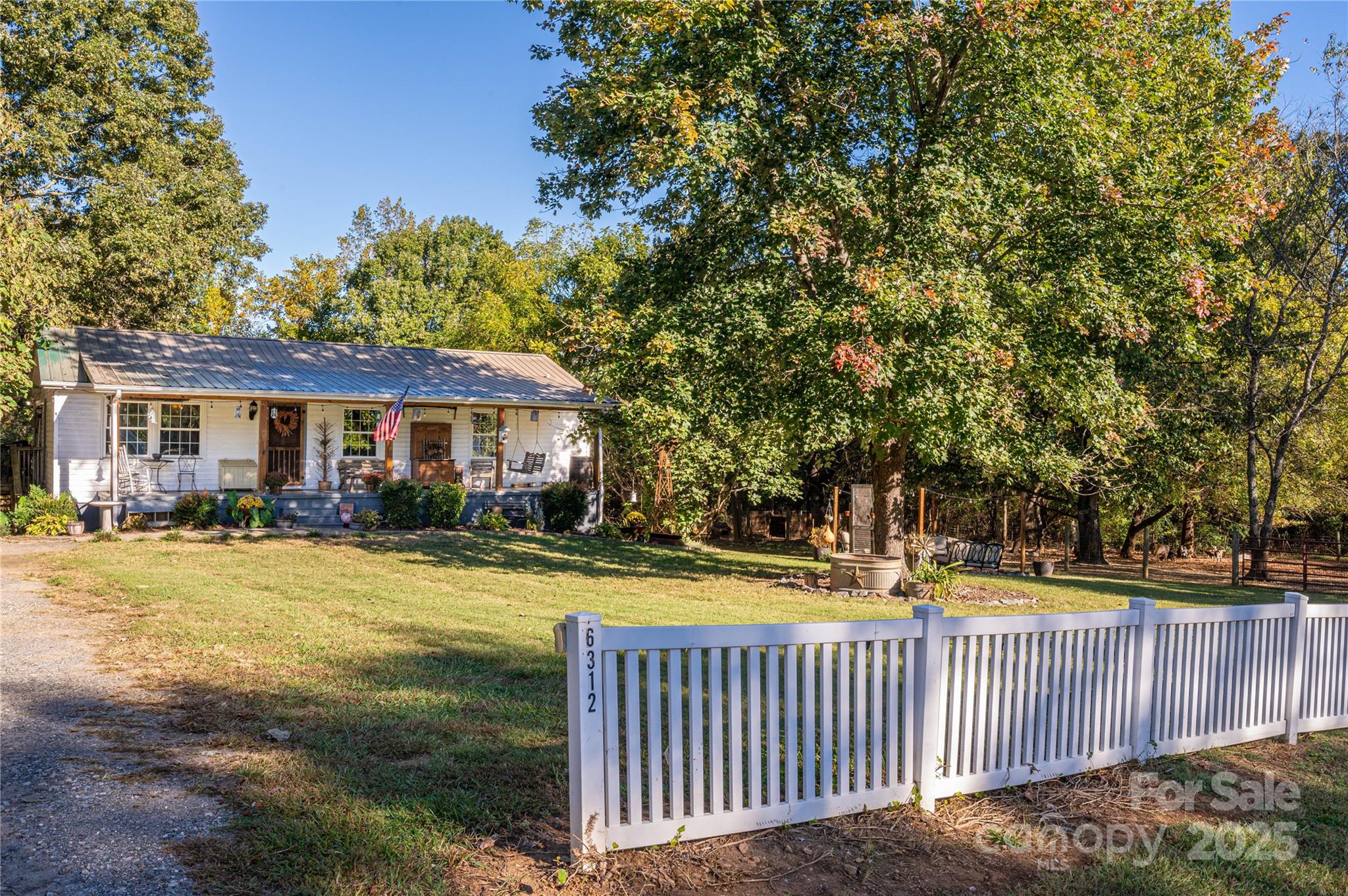 6312 Bill Ledford Road Vale, NC 28168 - Photo 33 of 42 a front view of house with yard and trees