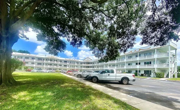 a view of outdoor space with garden and lots of trees