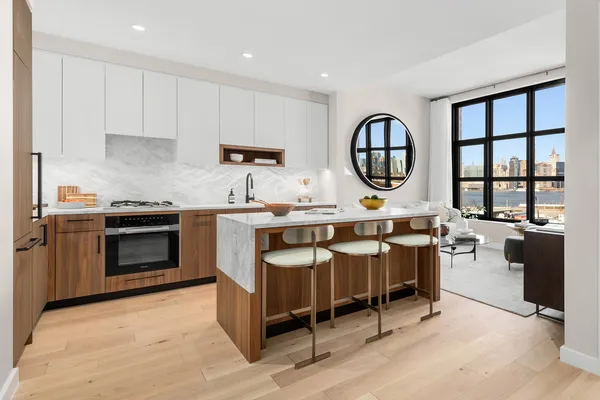 a kitchen with a stove a sink and a refrigerator