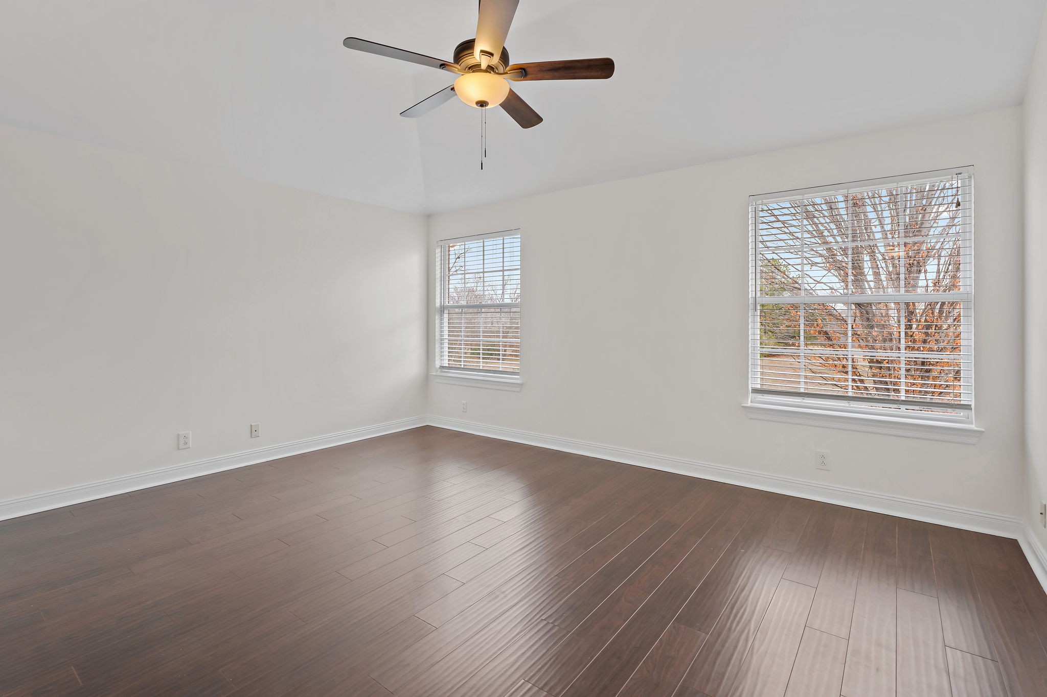 3140 Vera Valley Road Franklin, TN 37064 - Photo 31 of 38 an empty room with wooden floor ceiling fan and windows