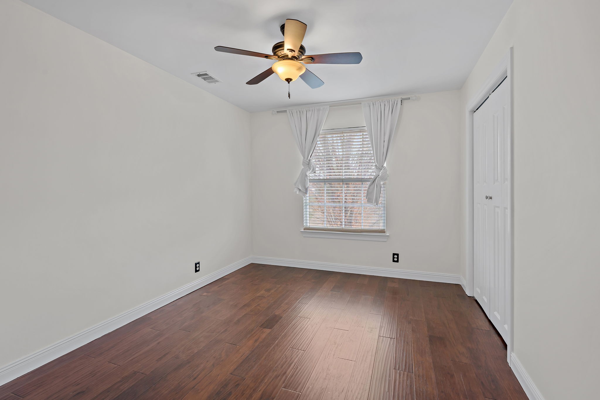 3140 Vera Valley Road Franklin, TN 37064 - Photo 32 of 38 an empty room with wooden floor and windows