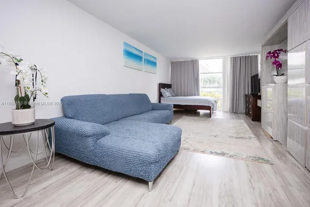 a living room with furniture and a rug
