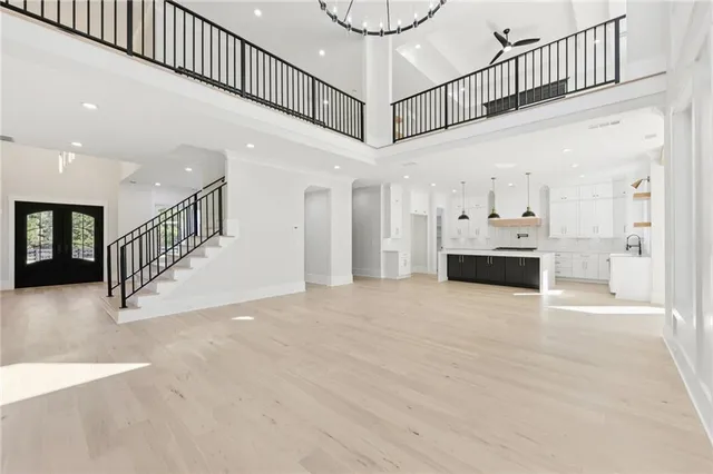 a view of an empty room with a chandelier