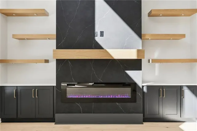 a very nice looking room with a large window and a chandelier