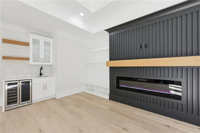 a bathroom with double vanity and a bathtub