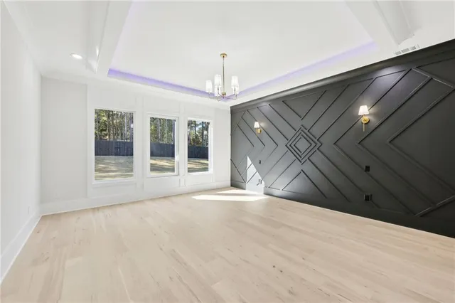 a kitchen with stainless steel appliances granite countertop a stove a sink and a wooden floors