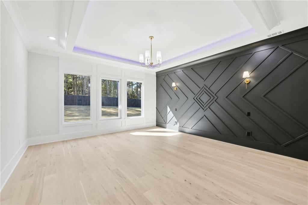 3207 Bold Springs Road Dacula, GA 30019 - Photo 20 of 67 a view of an empty room with wooden floor and a window